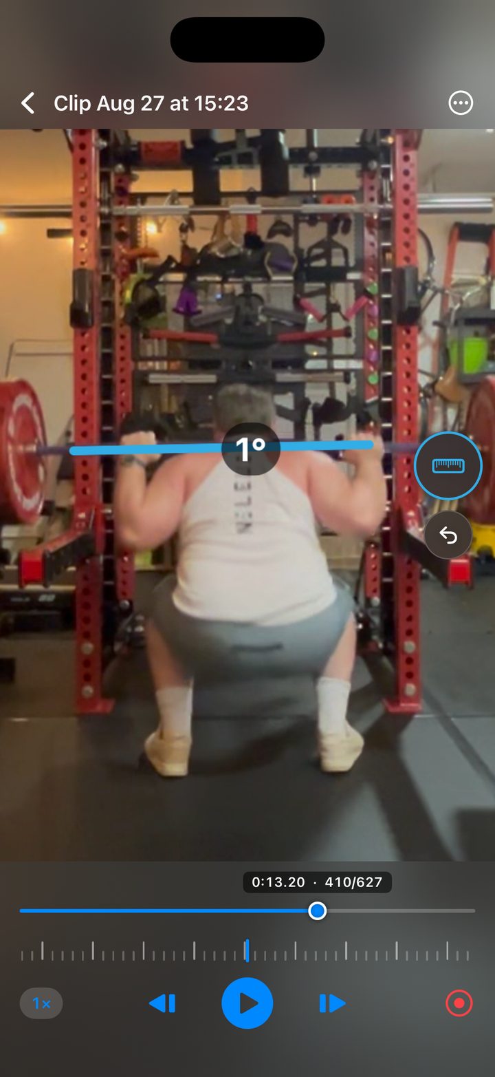 The player paused on frame 410 of a squat, with a measured line along the barbell reading 1 degree off level.